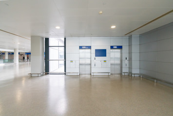 The lift lobby is in the airport waiting hall