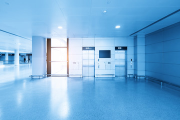 The lift lobby is in the airport waiting hall