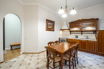 Wooden furniture and kitchen set in luxury kitchen interior. Arch.