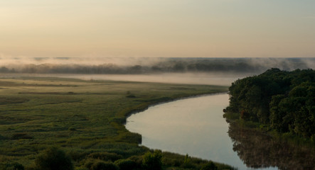 Fototapeta na wymiar Summer morning fog over the river in the Voronezh region, nature of Russia.