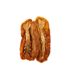 Dried red tomatoes isolated on white background