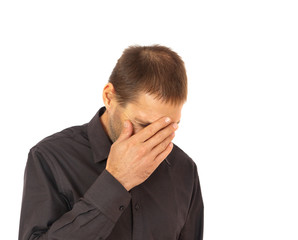 Young man in despair portrait isolated on white