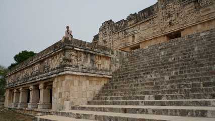 Man travels in ancient Uxmal in Mexico.