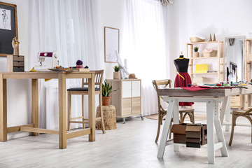 Fashion designer's workplace in studio. Creating new clothes