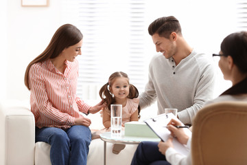 Professional psychologist working with family in office