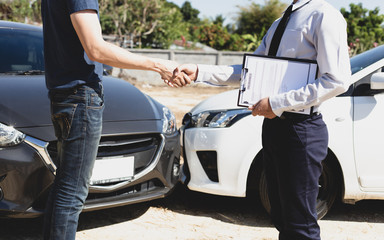 Customers shake hand with car insurance agents to enter into friendly terms and conditions, Car...