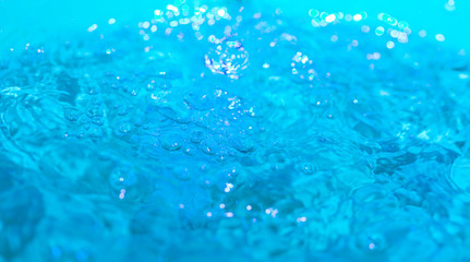 Naklejka na ściany i meble water splash on a blue background