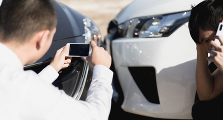 Insurance agents inspect for damage to cars that collide on the road to claim compensation from...