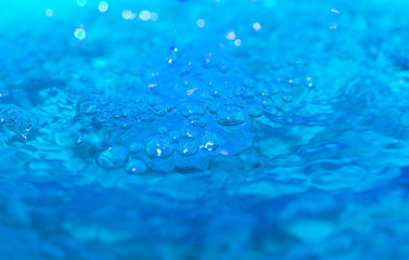 Naklejka na ściany i meble water splash on a blue background