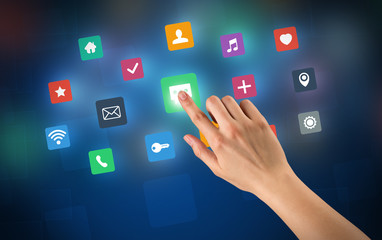 Female hand touching colorful applications