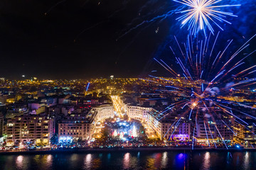 Aerial view of Aristotelous square in Thessaloniki during New Year celebrations with fantastic multi-colored fireworks