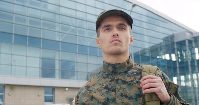 Portrait of soldier walking outdoors.