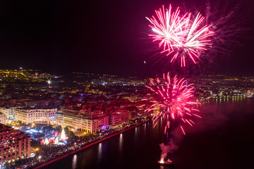 Aerial view of Aristotelous square in Thessaloniki during New Year celebrations with fantastic multi-colored fireworks