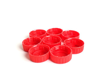 red plastic bottle caps isolated on white background.