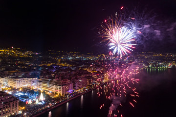 Aerial view of Aristotelous square in Thessaloniki during New Year celebrations with fantastic multi-colored fireworks