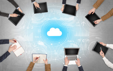Group of people with devices in hands working on reports with online teamwork and cloud technology...