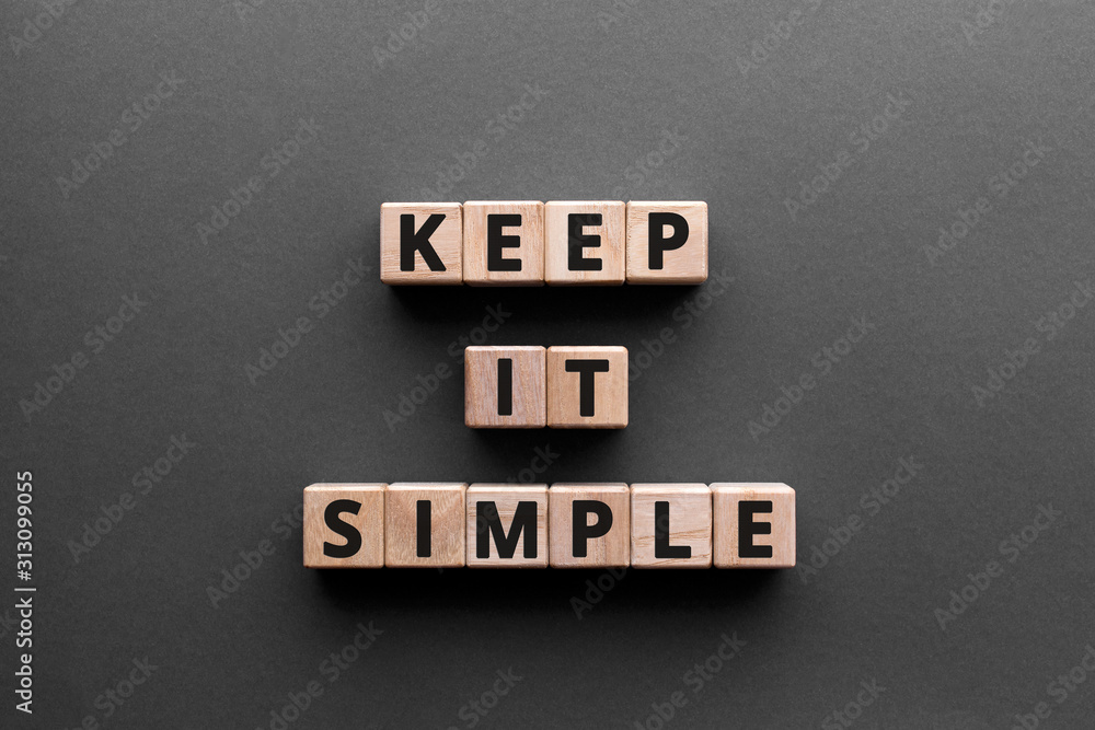 Poster keep it simple - word from wooden blocks with letters, to make something easy, keep it simple concep