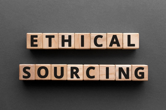 Ethical sourcing - word from wooden blocks with letters, responsible and sustainable methods ethical sourcing concept, gray background