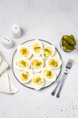 Holiday Easter one-bire snack, dill pickle deviled eggs.Top view, space for text.
