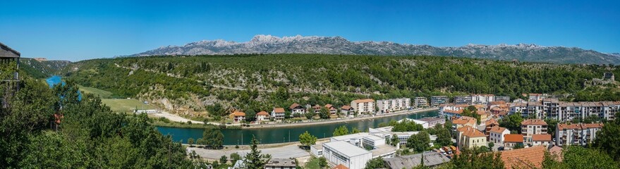 Fototapeta na wymiar View of the city of Obrovac, Zrmanja river, Croatia. Panorama