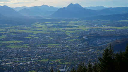 Aerial panorama of Salzburg and Alps from the top of Untersberg mountain in Austria.