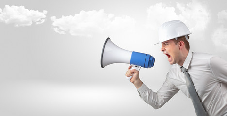 Fototapeta premium Young supervisor architect yelling to far big city panorama