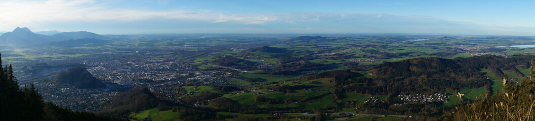 Fototapeta na wymiar Aerial panorama of Salzburg and Alps from the top of Untersberg mountain in Austria.