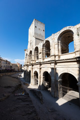 Naklejka premium The Arles Amphitheatre (Arenes d'Arles in French), a two-tiered Roman amphitheatre in the southern French town of Arles.