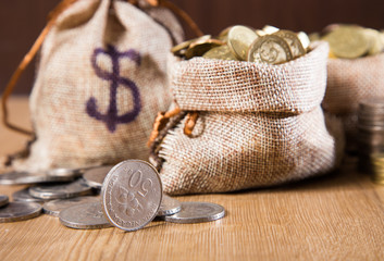 Coins on wooden background