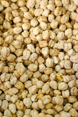 food background from a texture of raw chickpeas close-up. selective focus 