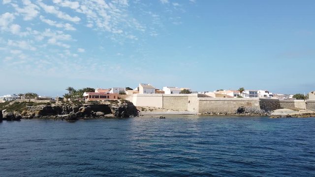 panoramic view of the harbor on the island of tabarca a day.