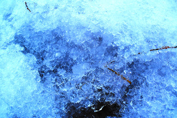 melting blue ice snow closeup