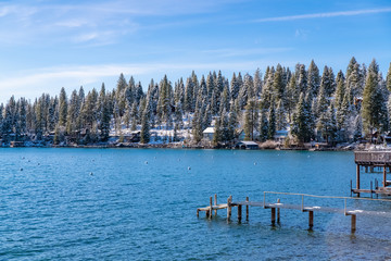 The Lake Tahoe in Nevada and California, panorama of a pontoon for mooring boats in winter, and...