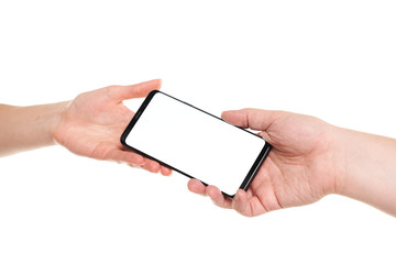 Man hand giving smartphone blank screen with modern frameless design to woman hand isolated on white background
