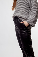 Beautiful sexy pretty girl with long brown hair and perfect body weared in black leather pants and...