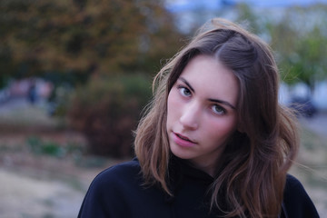 Young woman alone in an old city street