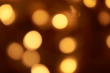 beautiful yellow bokeh lights background on dark