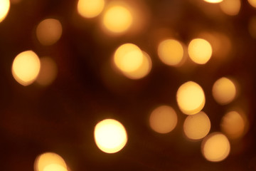 beautiful yellow bokeh lights background on dark