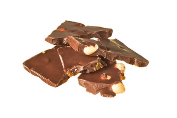 Heap of pieces of rectangular chocolate bar with peanut and raisin isolated on white background