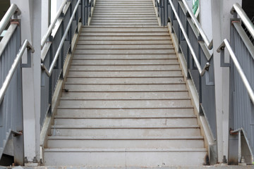 Staircase with stainless steel handrails. 