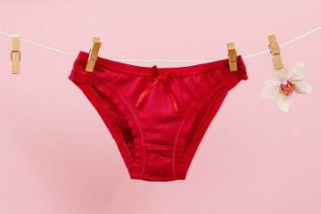 Beautiful women's cotton panties on pink background.