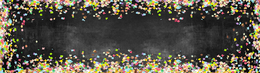 Carnival background panorama banner long - Frame made of colorful confetti isolated on black stone...