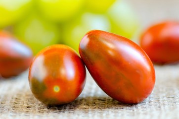 Ripe juicy tomatoes lie on the table, concept of a large crop of