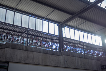 Bicycles are hanging at parking place at train station for background, copy space