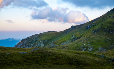 Fototapeta premium Sunrise on Fagaras high mountain ridge. Romanian mountain landscape with high peaks over 2200m