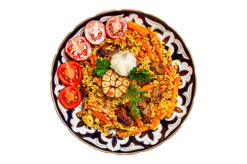 Uzbek pilaf with lamb in an Uzbek plate with a blue pattern. isolated