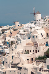 Fototapeta premium Classical view on the decoration and architecture of Oia village Santorini at sun weather
