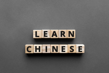 Learn chinese - words from wooden blocks with letters, learn chinese  concept, top view gray...