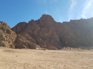 Fototapeta na wymiar Landscape with mountains in Egypt. Rocky hills. Blue sky