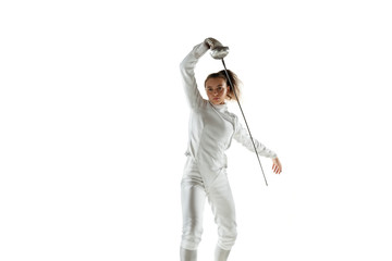 Champion. Teen girl in fencing costume with sword in hand isolated on white background. Young...